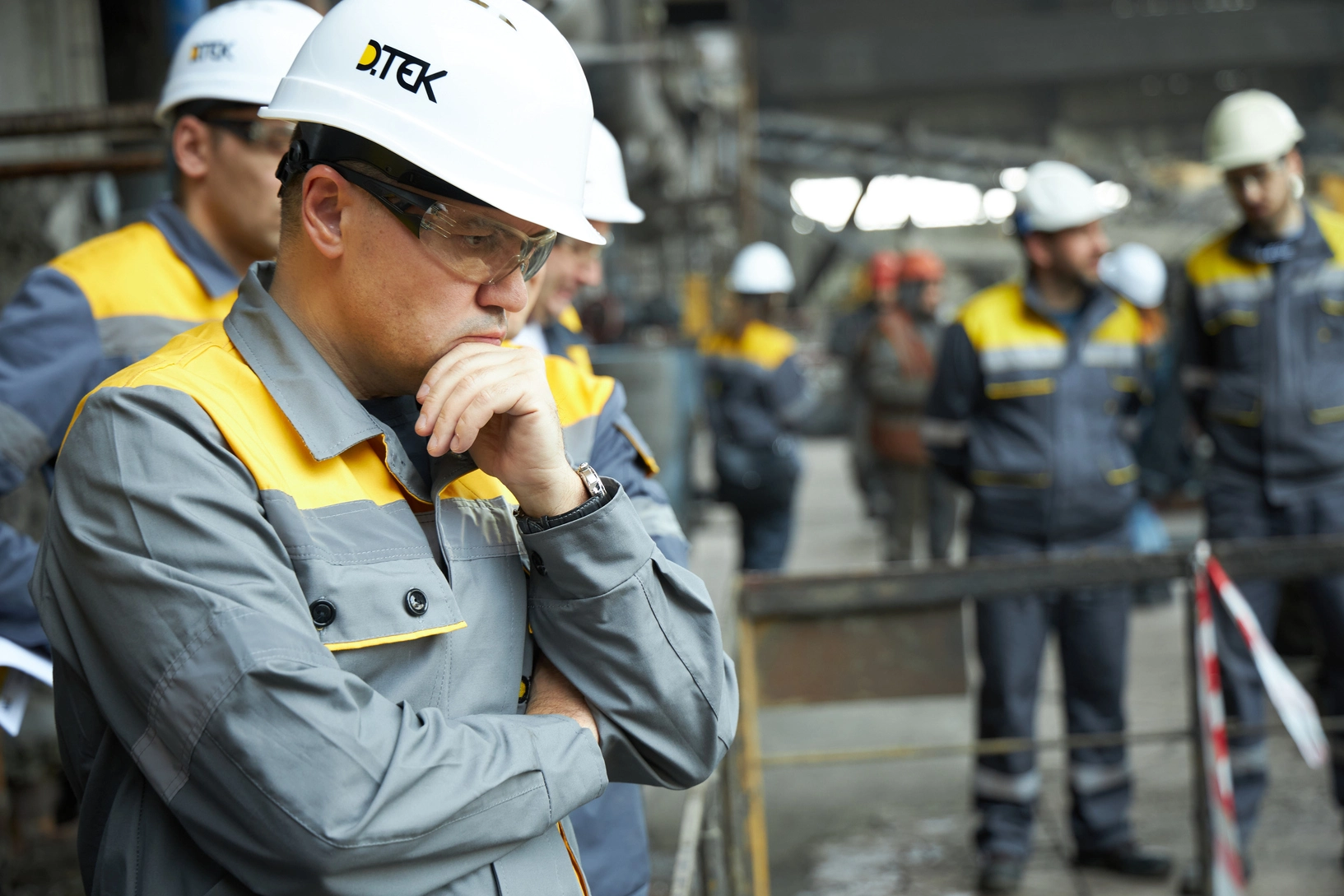 DTEK CEO Maxim Timchenko and employees inspect damage at a DTEK power station after russian attacks in March 2024. The precise location and date are not disclosed due to security restrictions.