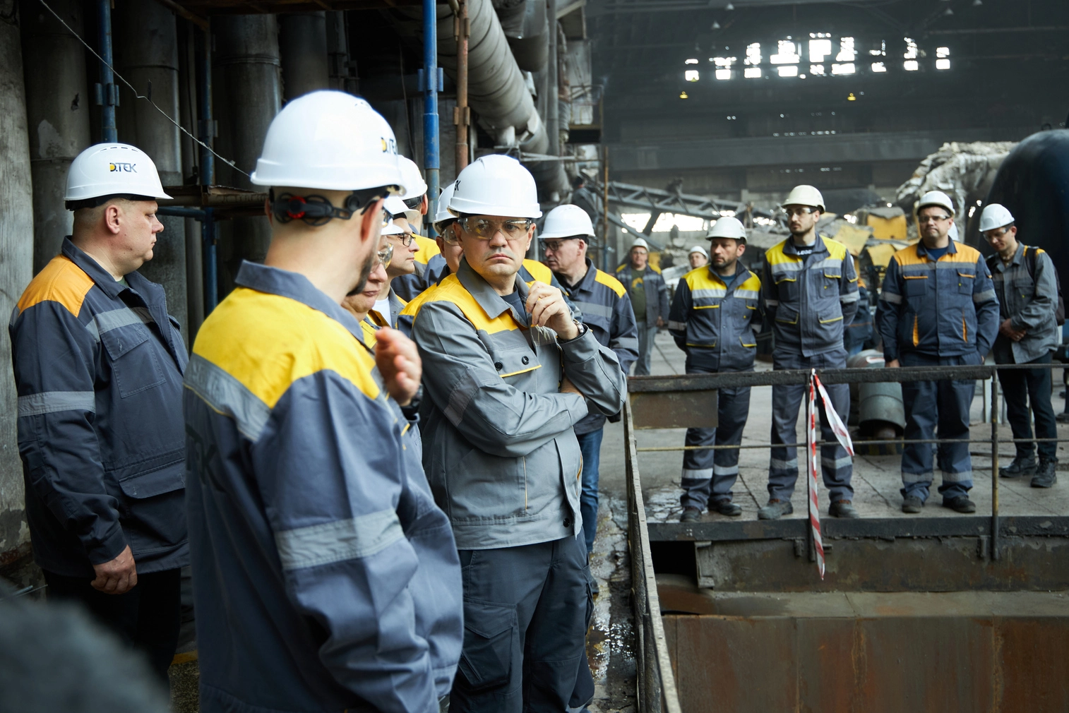 DTEK CEO Maxim Timchenko and employees inspect damage at a DTEK power station after russian attacks in March 2024. The precise location and date are not disclosed due to security restrictions.