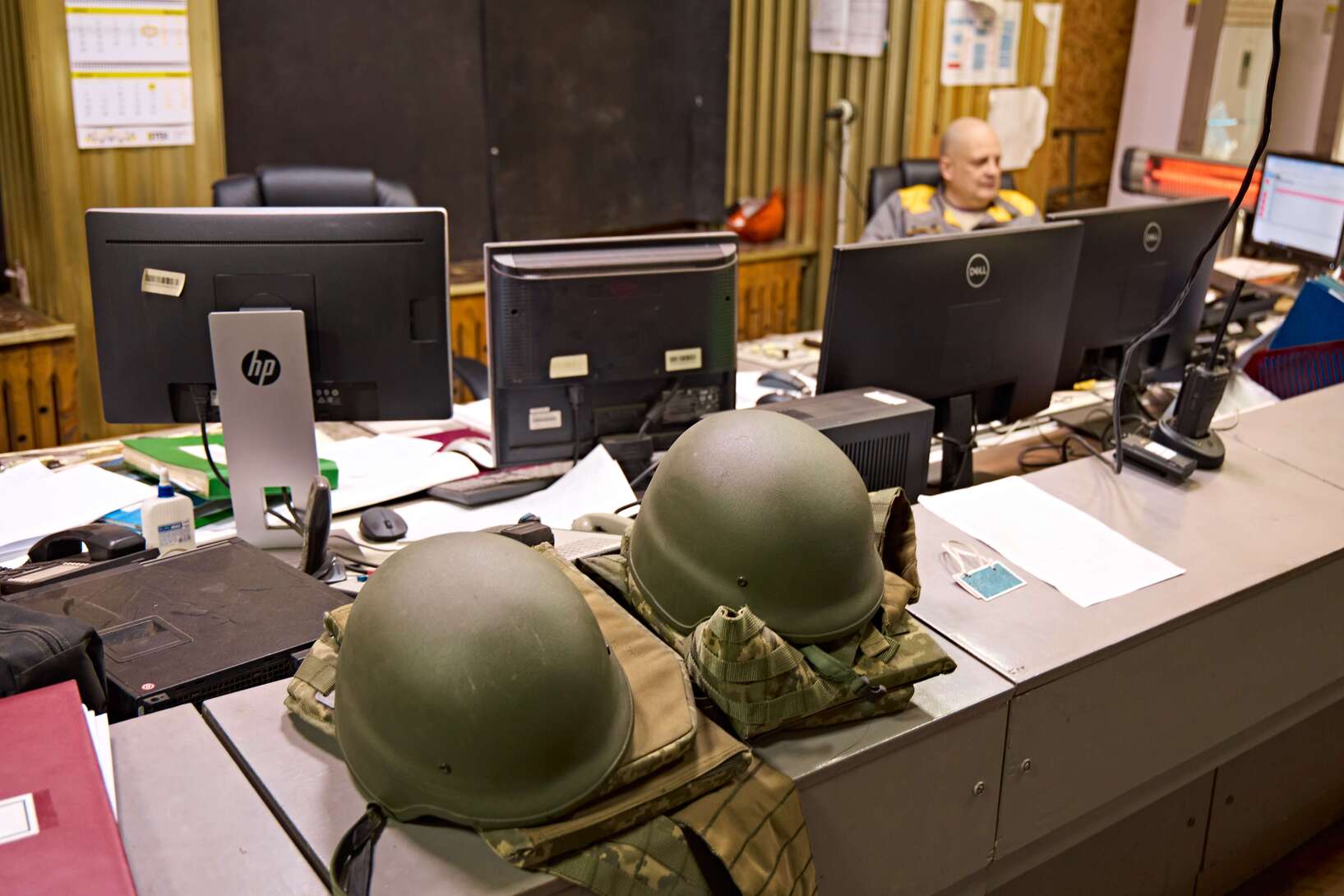 Protective gear worn by DTEK power engineers during air raid alarms