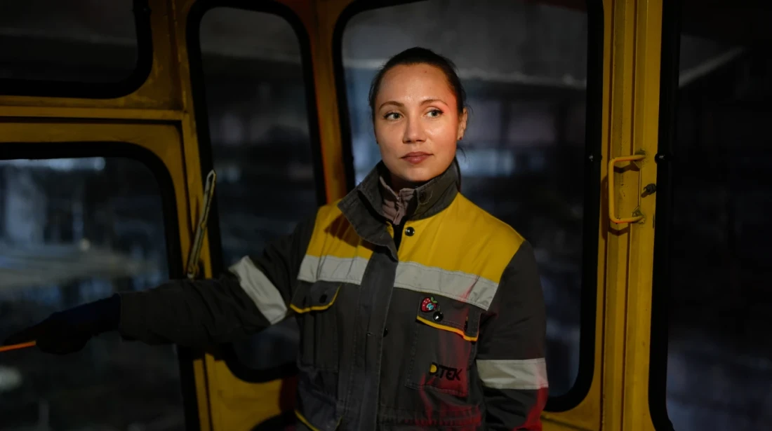 Maria, 35, a bridge crane operator, who declined to give her surname due to security concerns, poses for a portrait at a Ukrainian thermal power plant, Wednesday, Oct. 29, 2025. Her heart sinks anytime she hears missiles overhead, praying they don’t hit h