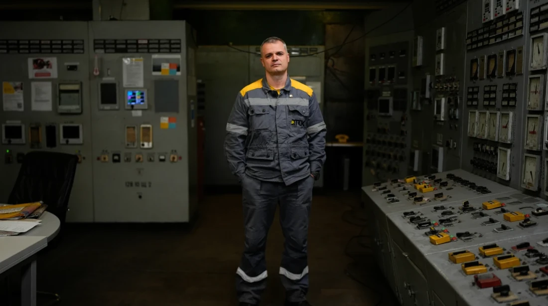 Mykhailo, 45, a senior power unit engineer, who declined to give his surname due to security concerns, poses for a portrait in the control room of a Ukrainian thermal power plant, Wednesday, Oct. 29, 2025. “If all the turbine operators hid during attacks,